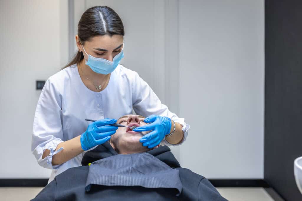 female dentist treating patient for sinus lifting surgery