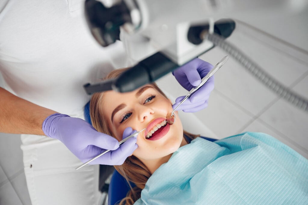 Beautiful lady in the dentist's office for dental implants